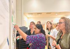 People looking at whiteboard