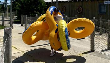 Tommy holding inner tubes